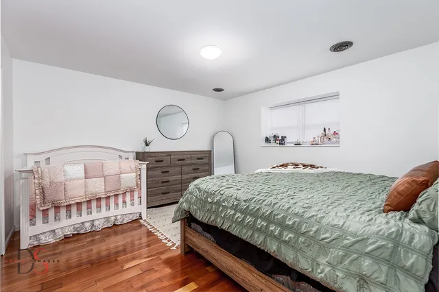 a room with a dresser and a window