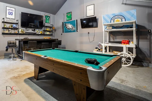 a kitchen with a dining table and chairs