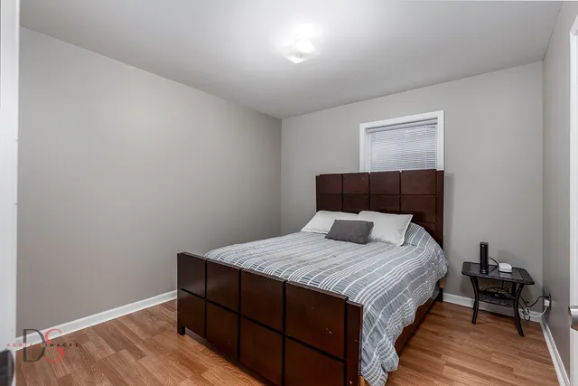 a bathroom with a double vanity sink mirror and shower