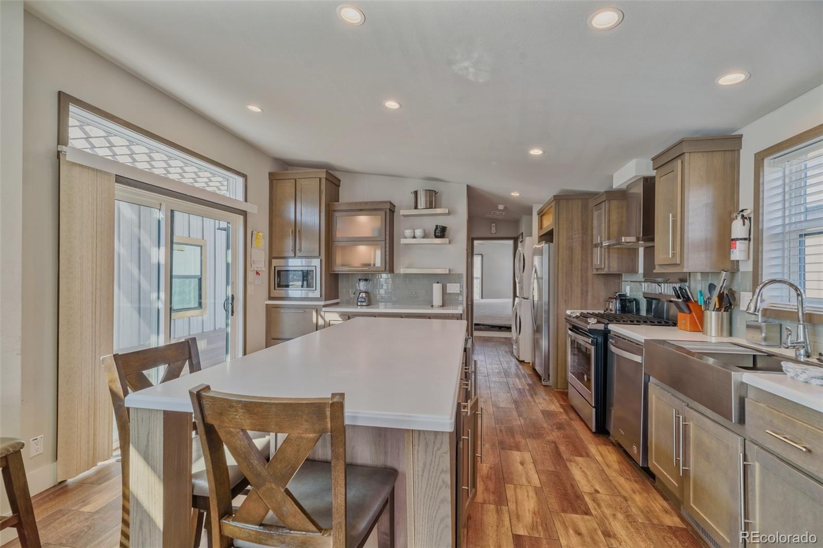 1051 Summit Trail Granby, CO 80446 - Photo 15 of 50 a large kitchen with a table and chairs