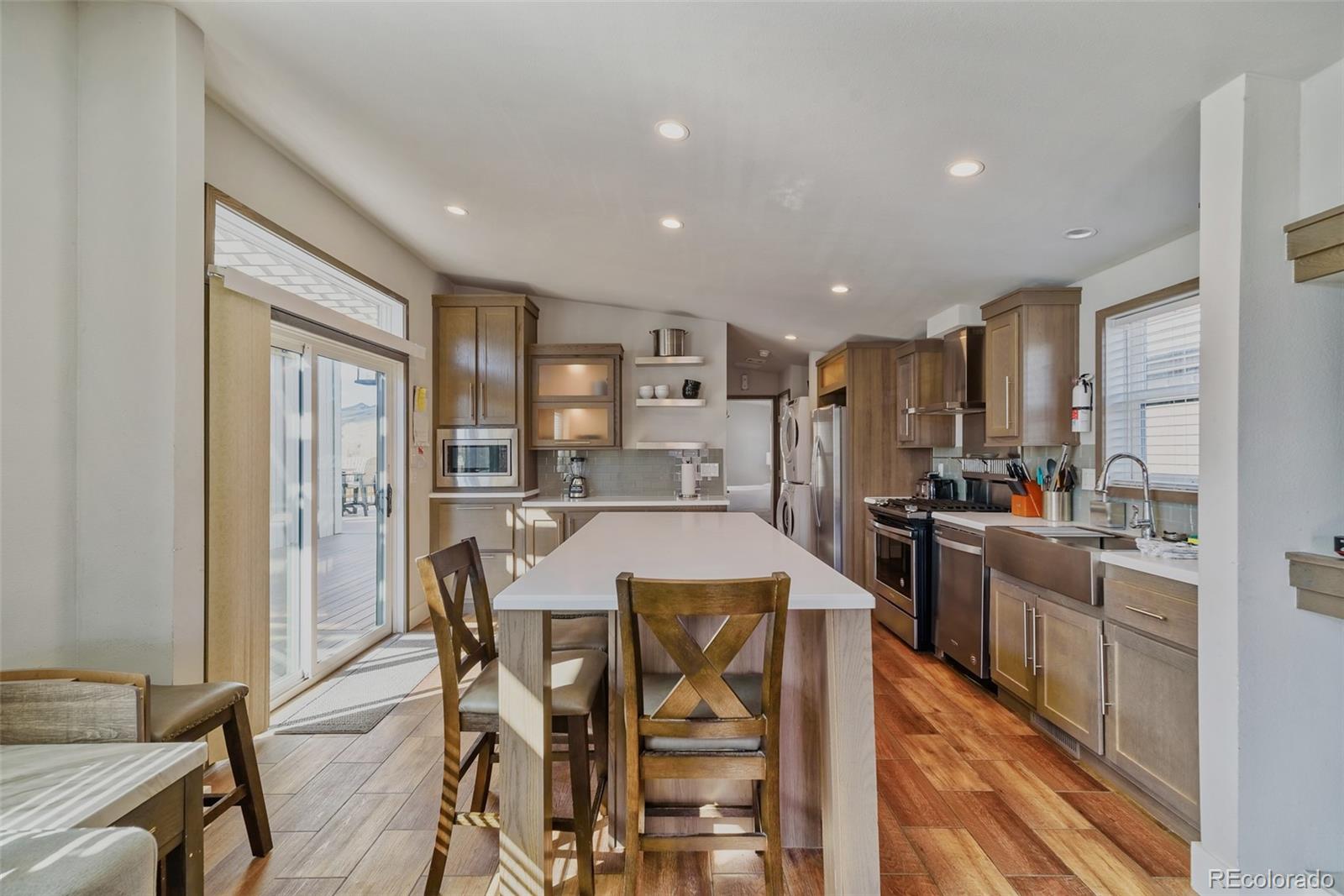1051 Summit Trail Granby, CO 80446 - Photo 16 of 50 a large kitchen with a table and chairs