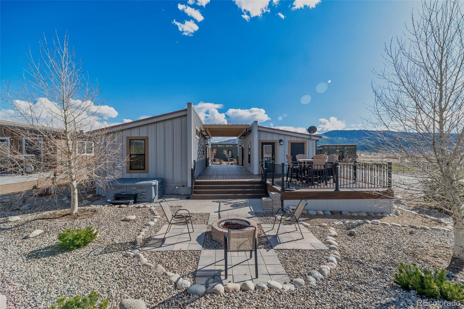 1051 Summit Trail Granby, CO 80446 - Photo 27 of 50 a view of a house with backyard and sitting area