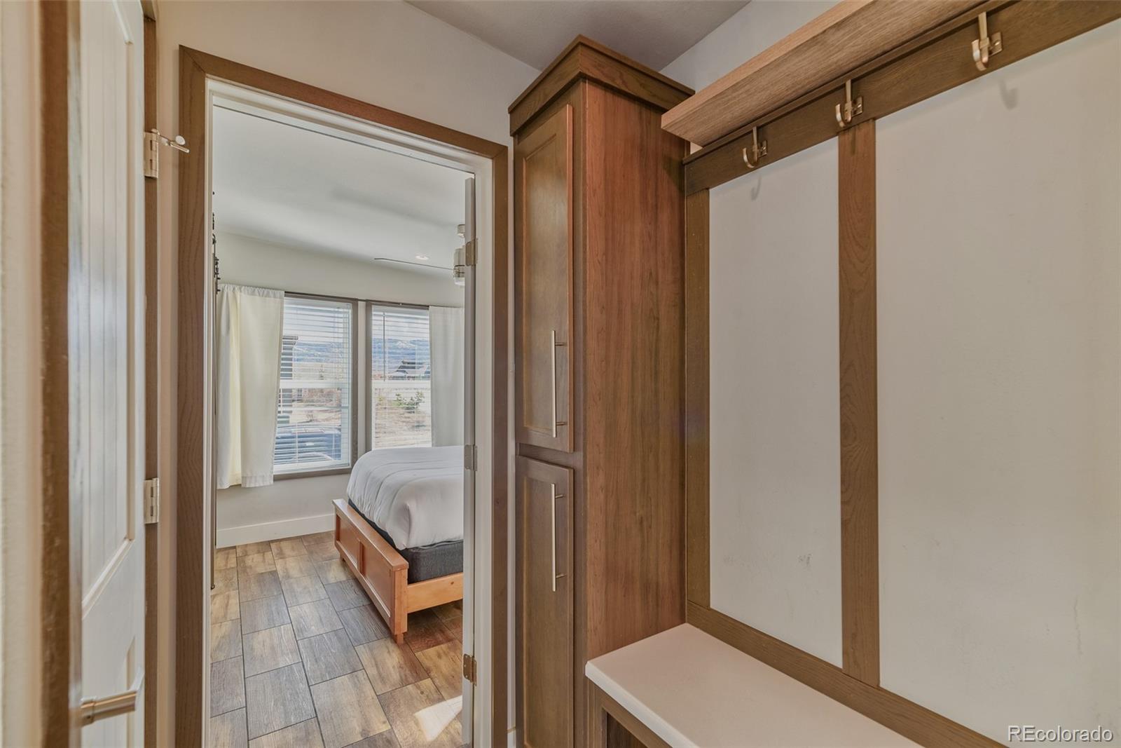 1051 Summit Trail Granby, CO 80446 - Photo 30 of 50 a view of a hallway with wooden floor and staircase