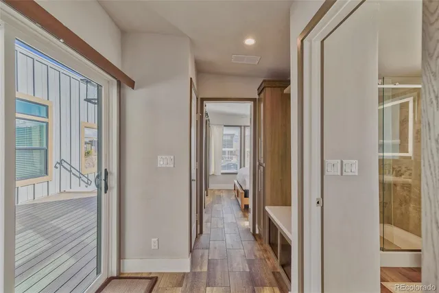 a living room with furniture and painting on the wall
