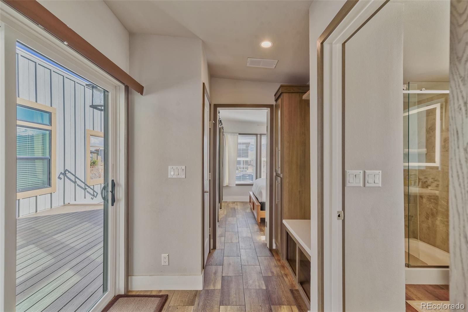 1051 Summit Trail Granby, CO 80446 - Photo 32 of 50 a view of a hallway with wooden floor and staircase