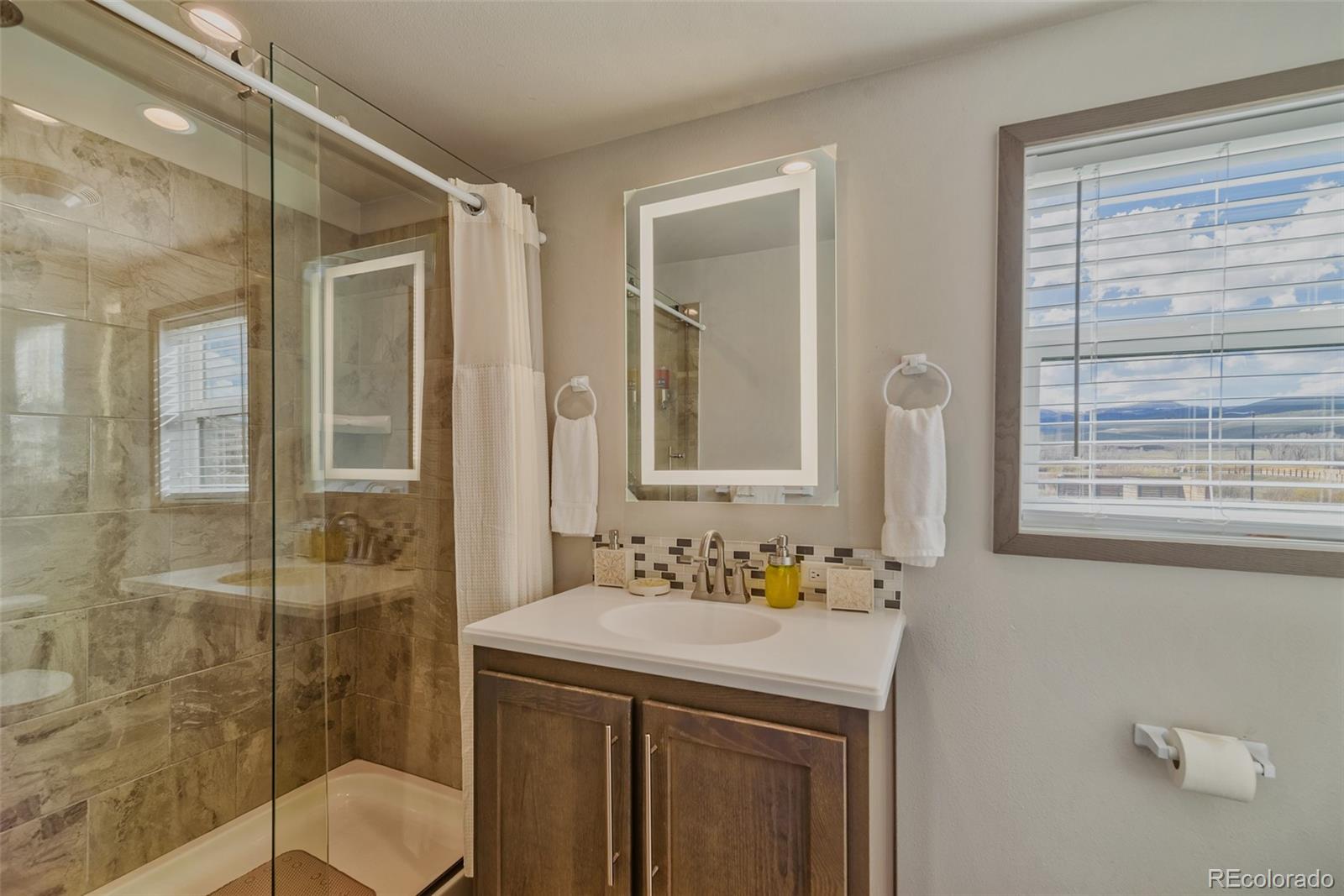 1051 Summit Trail Granby, CO 80446 - Photo 41 of 50 a bathroom with a sink toilet and shower