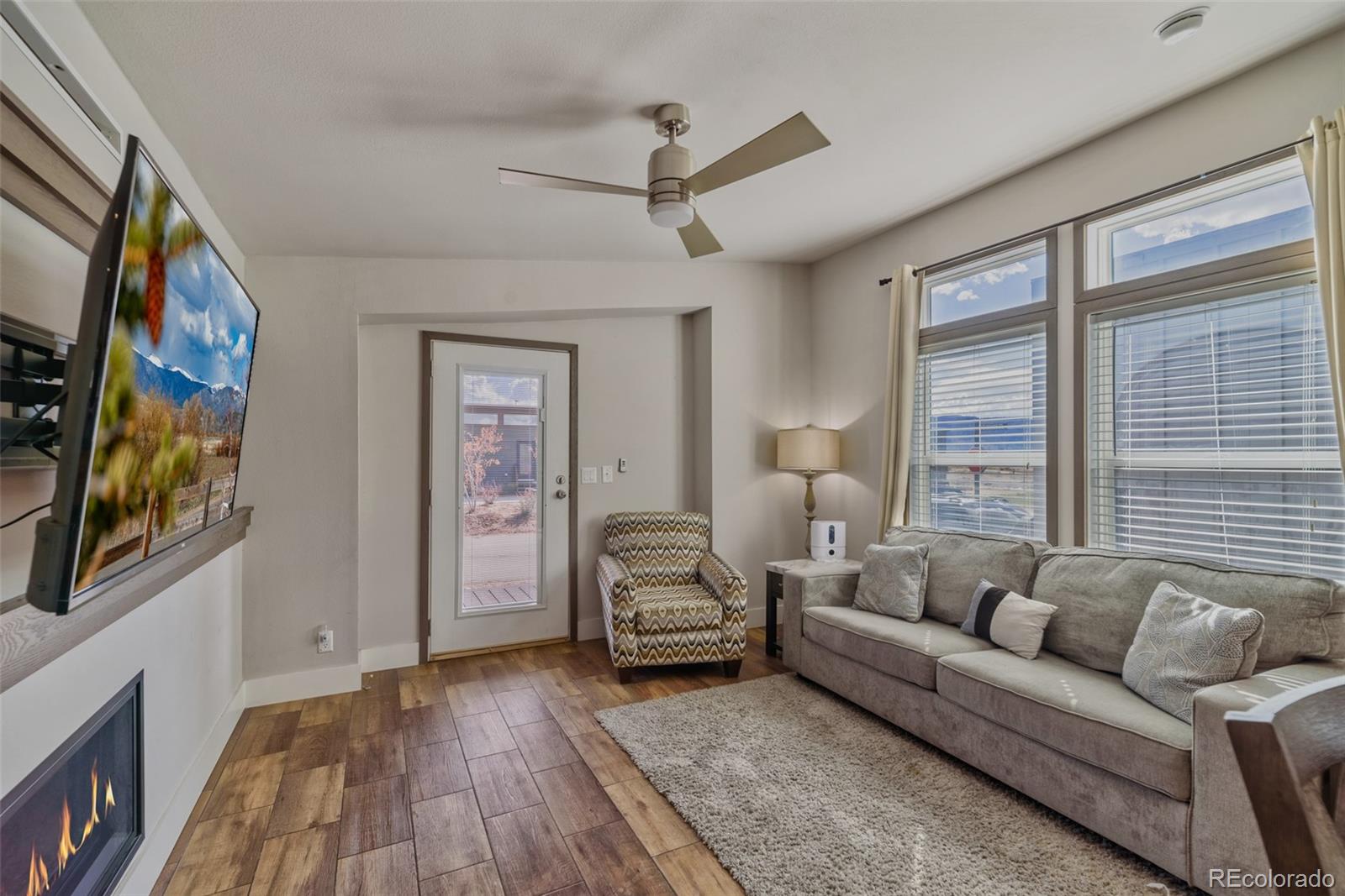 1051 Summit Trail Granby, CO 80446 - Photo 5 of 50 a living room with furniture and a flat screen tv