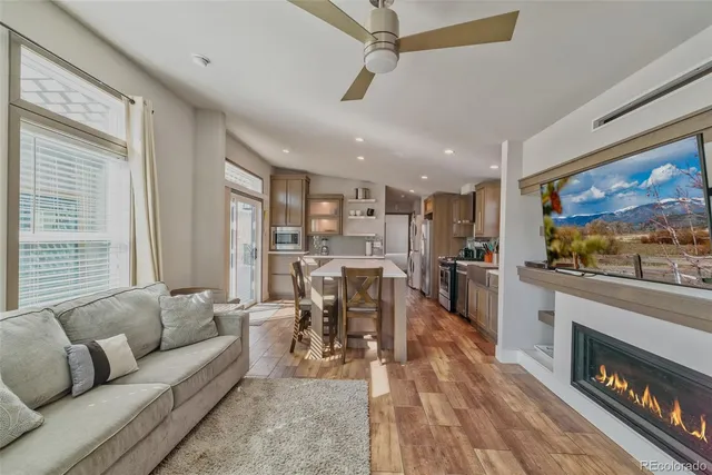 a kitchen with counter top space and wooden floor