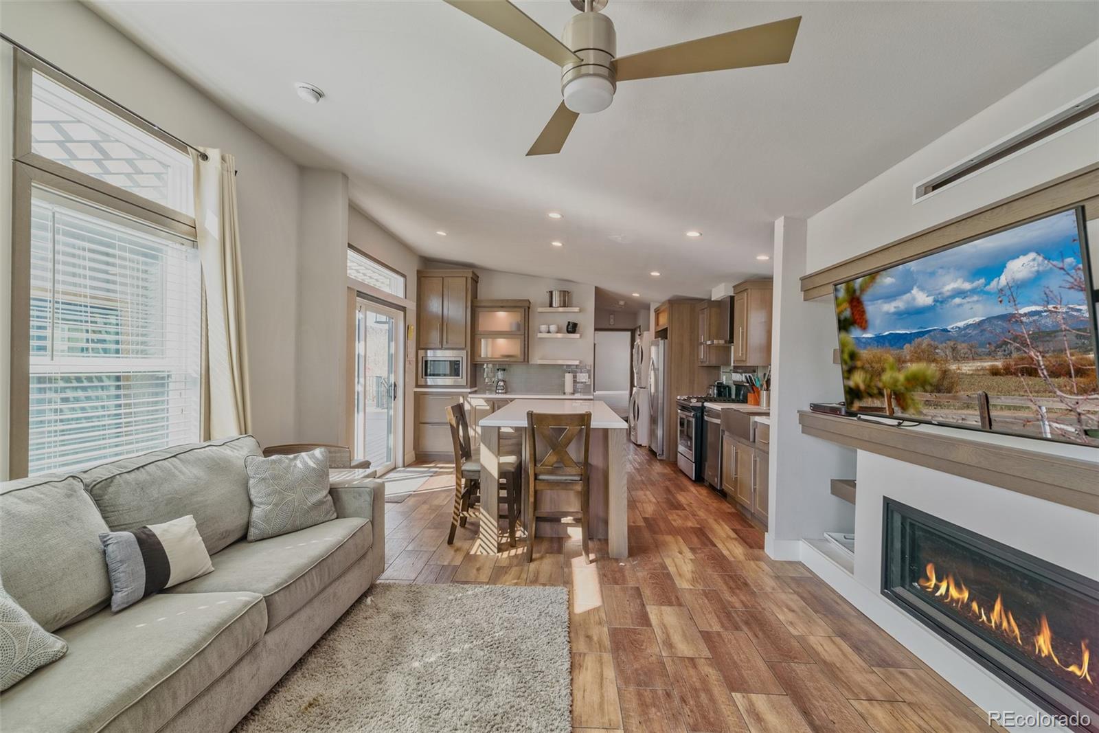 1051 Summit Trail Granby, CO 80446 - Photo 6 of 50 a living room with furniture and a flat screen tv