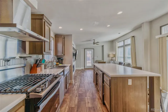 a kitchen with a sink stove and refrigerator