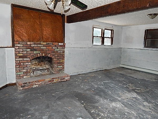 80 Brooks Village Road Phillipston, MA 01331 - Photo 9 of 16 a view of empty room with fireplace and window