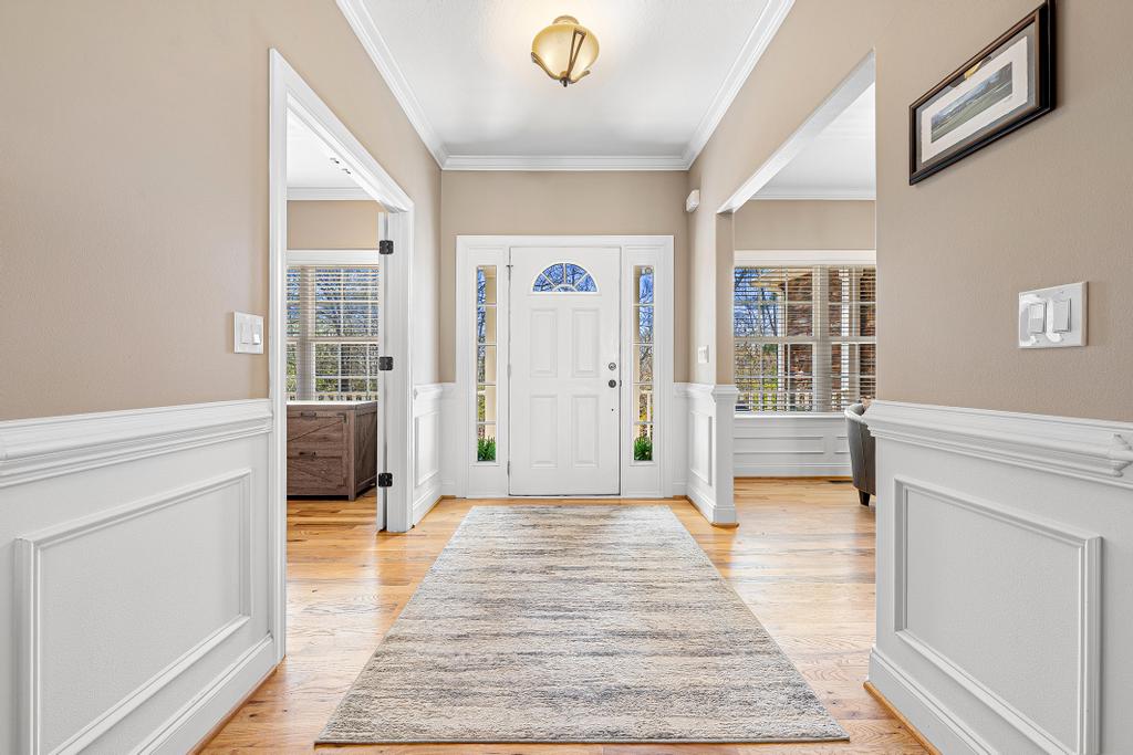 604 Feathery Lane Seneca, SC 29678 - Photo 17 of 44 Step into this welcoming entryway featuring warm hardwood floors and wainscoting.