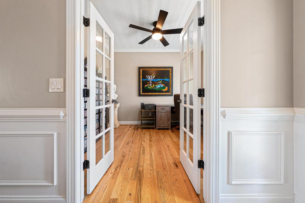 604 Feathery Lane Seneca, SC 29678 - Photo 19 of 44 This bright office space offers a productive environment, featuring classic French doors and warm wood flooring.