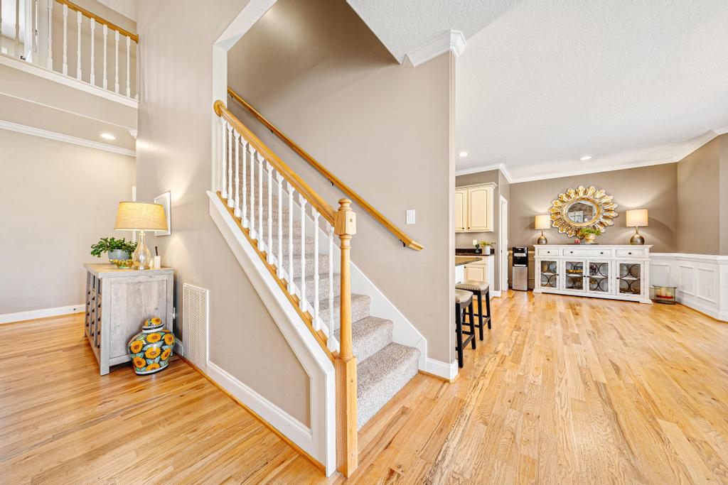 604 Feathery Lane Seneca, SC 29678 - Photo 26 of 44 This inviting interior features a grand staircase and gleaming hardwood floors, perfect for a dynamic lifestyle.