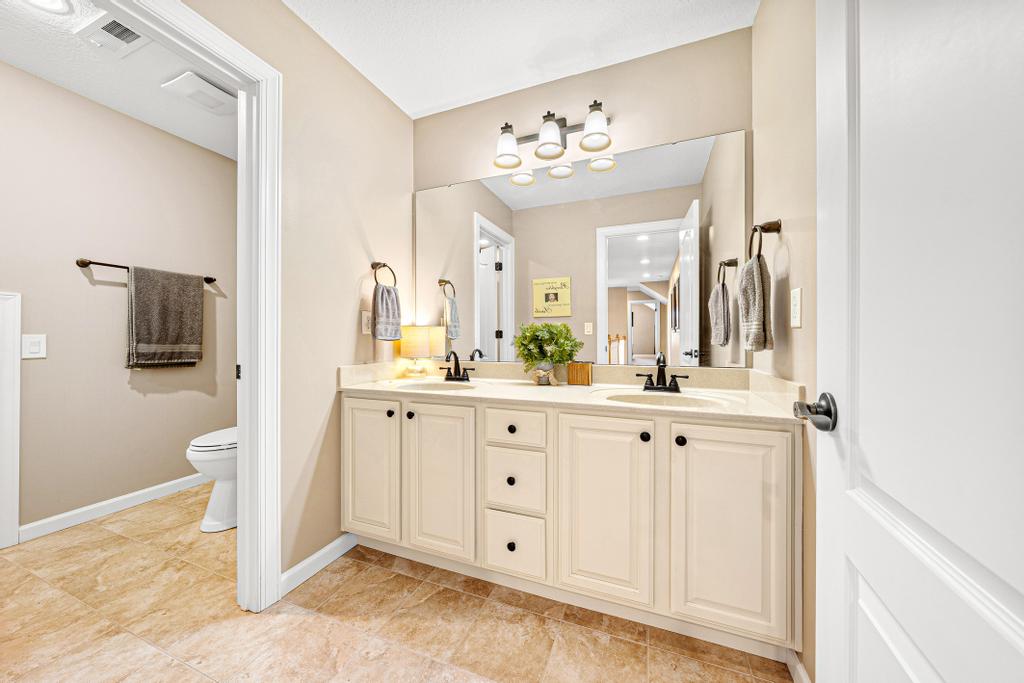 604 Feathery Lane Seneca, SC 29678 - Photo 30 of 44 This bathroom offers dual vanities with ample counter space and a clean, inviting atmosphere.