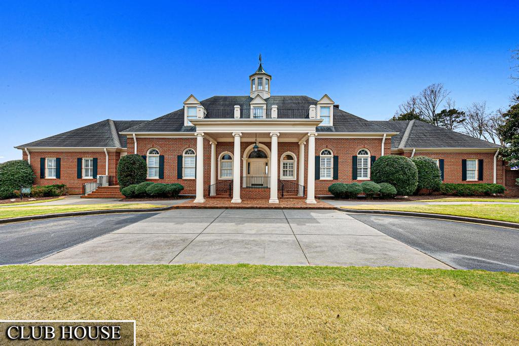 604 Feathery Lane Seneca, SC 29678 - Photo 3 of 44 This classic brick clubhouse offers a stately facade and welcoming entrance, perfect for community gatherings.