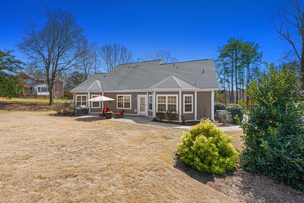 604 Feathery Lane Seneca, SC 29678 - Photo 33 of 44 This charming home offers a serene retreat with a spacious yard, perfect for outdoor living and entertaining.