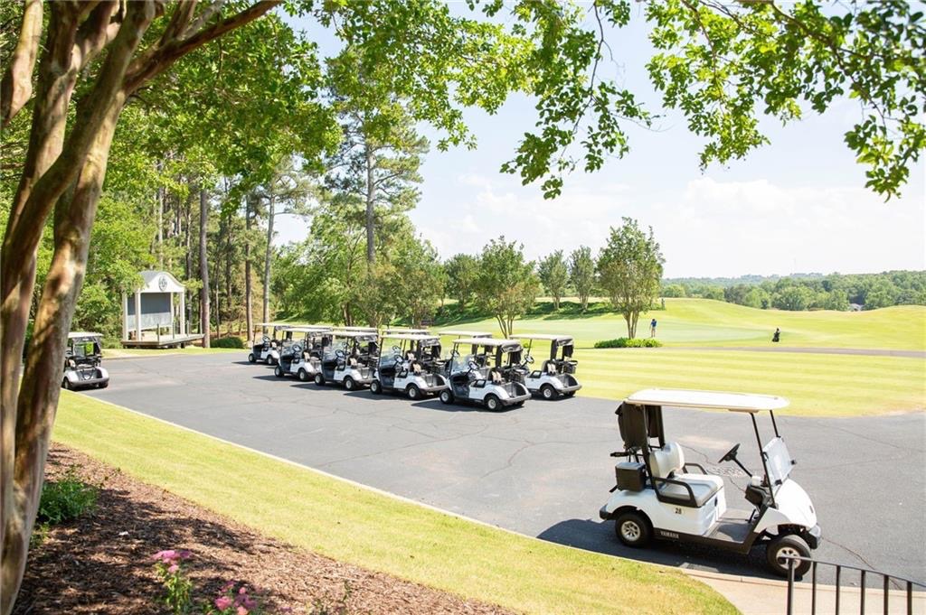 604 Feathery Lane Seneca, SC 29678 - Photo 4 of 44 This scenic golf course features ample parking for golf carts, surrounded by lush, mature trees.