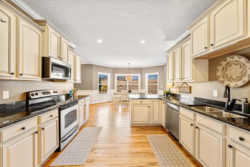 604 Feathery Lane Seneca, SC 29678 - Photo 10 of 44 Bright and open kitchen with modern amenities and a charming dining area.