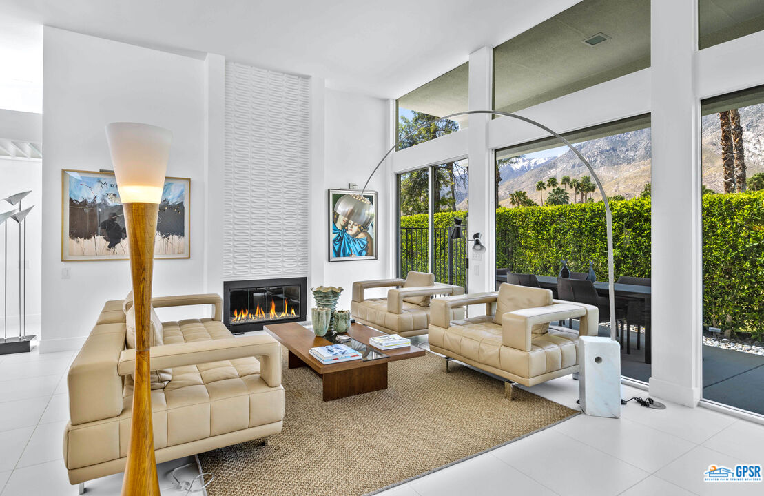 2649 Kings Road West Palm Springs, CA 92264 - Photo 16 of 50 a living room with furniture and a large window