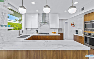 2649 Kings Road West Palm Springs, CA 92264 - Photo 23 of 50 a kitchen with a stove a sink and a refrigerator