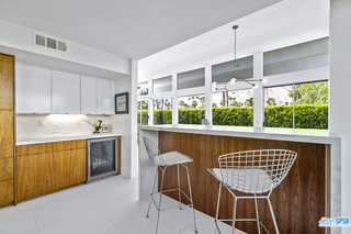 2649 Kings Road West Palm Springs, CA 92264 - Photo 24 of 50 a kitchen with stainless steel appliances granite countertop a stove a sink dishwasher and a microwave oven with cabinets