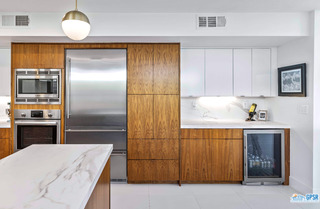 2649 Kings Road West Palm Springs, CA 92264 - Photo 25 of 50 a kitchen with kitchen island granite countertop stainless steel appliances and wooden cabinets