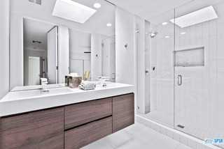 2649 Kings Road West Palm Springs, CA 92264 - Photo 37 of 50 a bathroom with a double vanity sink mirror and shower
