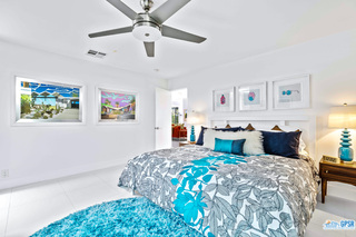 2649 Kings Road West Palm Springs, CA 92264 - Photo 39 of 50 a bed room with large bed and painting on the wall