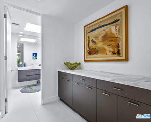 2649 Kings Road West Palm Springs, CA 92264 - Photo 40 of 50 a view of cabinets a sink and a painting on the wall