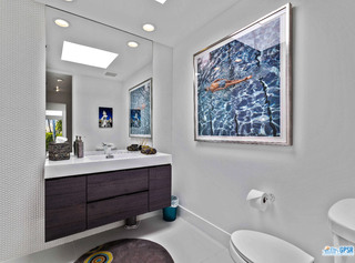 2649 Kings Road West Palm Springs, CA 92264 - Photo 41 of 50 a bathroom with a toilet sink and mirror