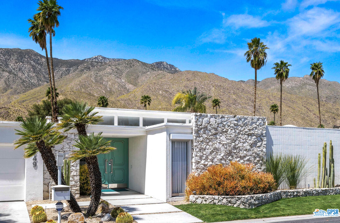 2649 Kings Road West Palm Springs, CA 92264 - Photo 6 of 50 a view of a house with a yard and potted plants