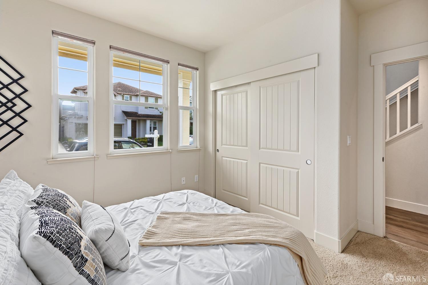 119 Cypress Street Pacifica, CA 94044 - Photo 15 of 30 a bedroom with a bed and a window