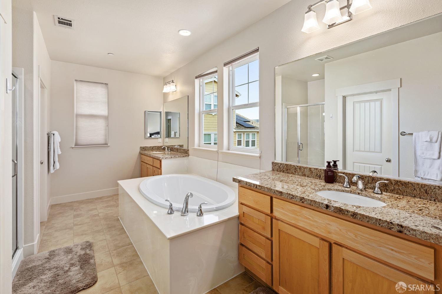 119 Cypress Street Pacifica, CA 94044 - Photo 28 of 30 a bathroom with a granite countertop tub sink and mirror