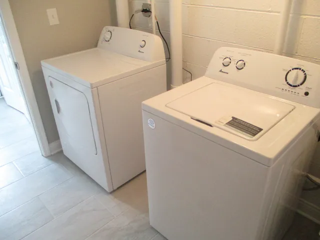 a utility room with dryer and washer
