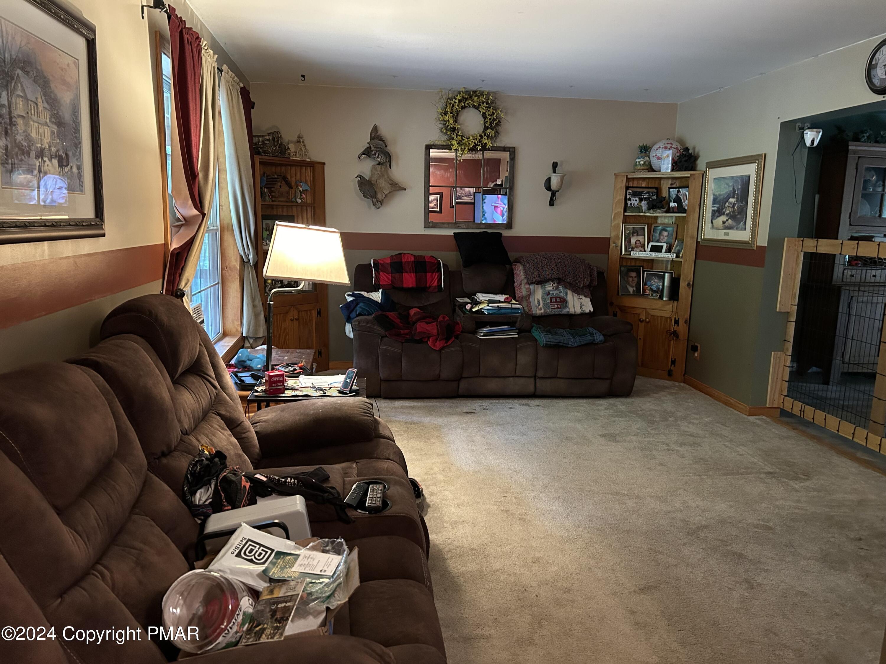 234 Shiffer Road Stroudsburg, PA 18360 - Photo 3 of 14 a room with furniture and a couch