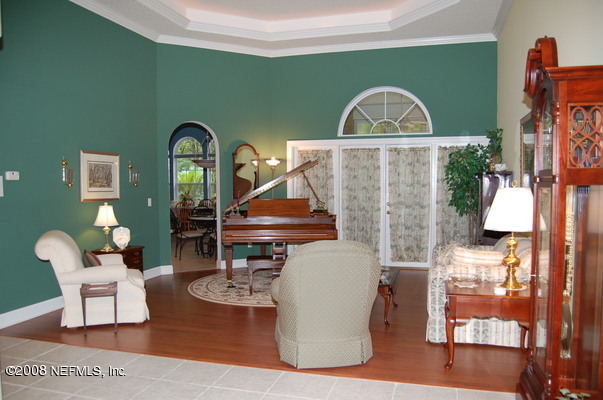 12819 Mandarin Road Jacksonville, FL 32223 - Photo 6 of 18 a living room with furniture and a wooden floor
