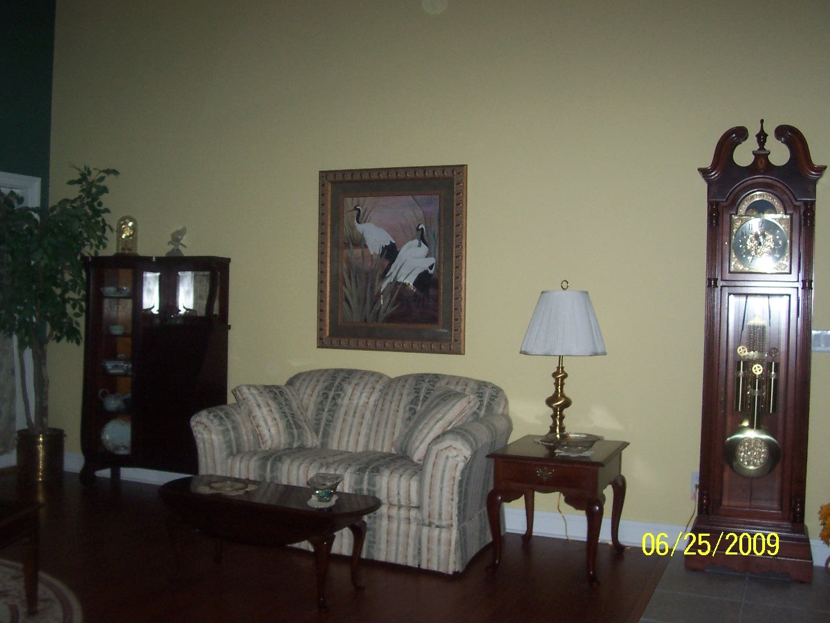 12819 Mandarin Road Jacksonville, FL 32223 - Photo 7 of 18 a living room with furniture and a lamp