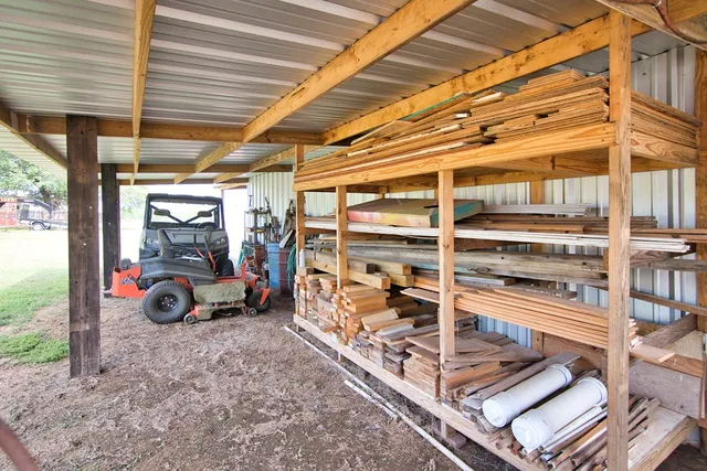 a aerial view of a house with swimming pool and a yard