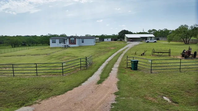 a view of a balcony with two chairs