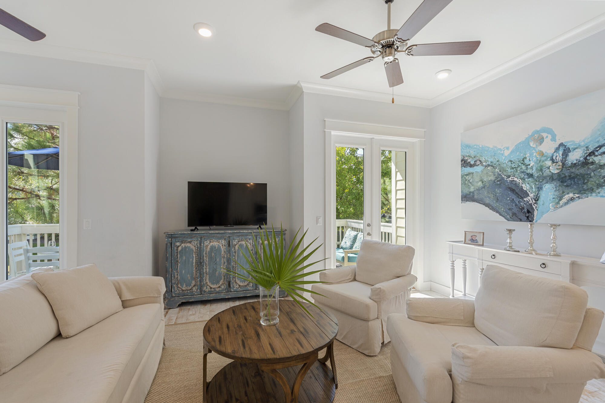 296 Milestone Dr Inlet Beach, Unit A Inlet Beach, FL 32461 - Photo 12 of 41 a living room with furniture and a flat screen tv