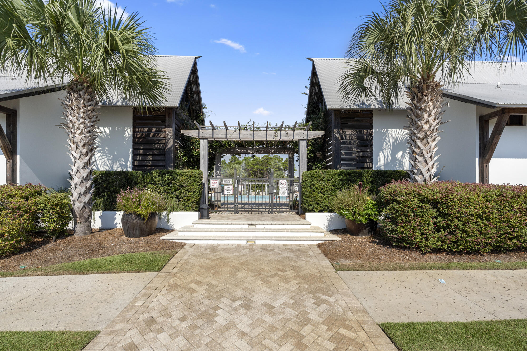 296 Milestone Dr Inlet Beach, Unit A Inlet Beach, FL 32461 - Photo 26 of 41 a view of a house with a yard and potted plants