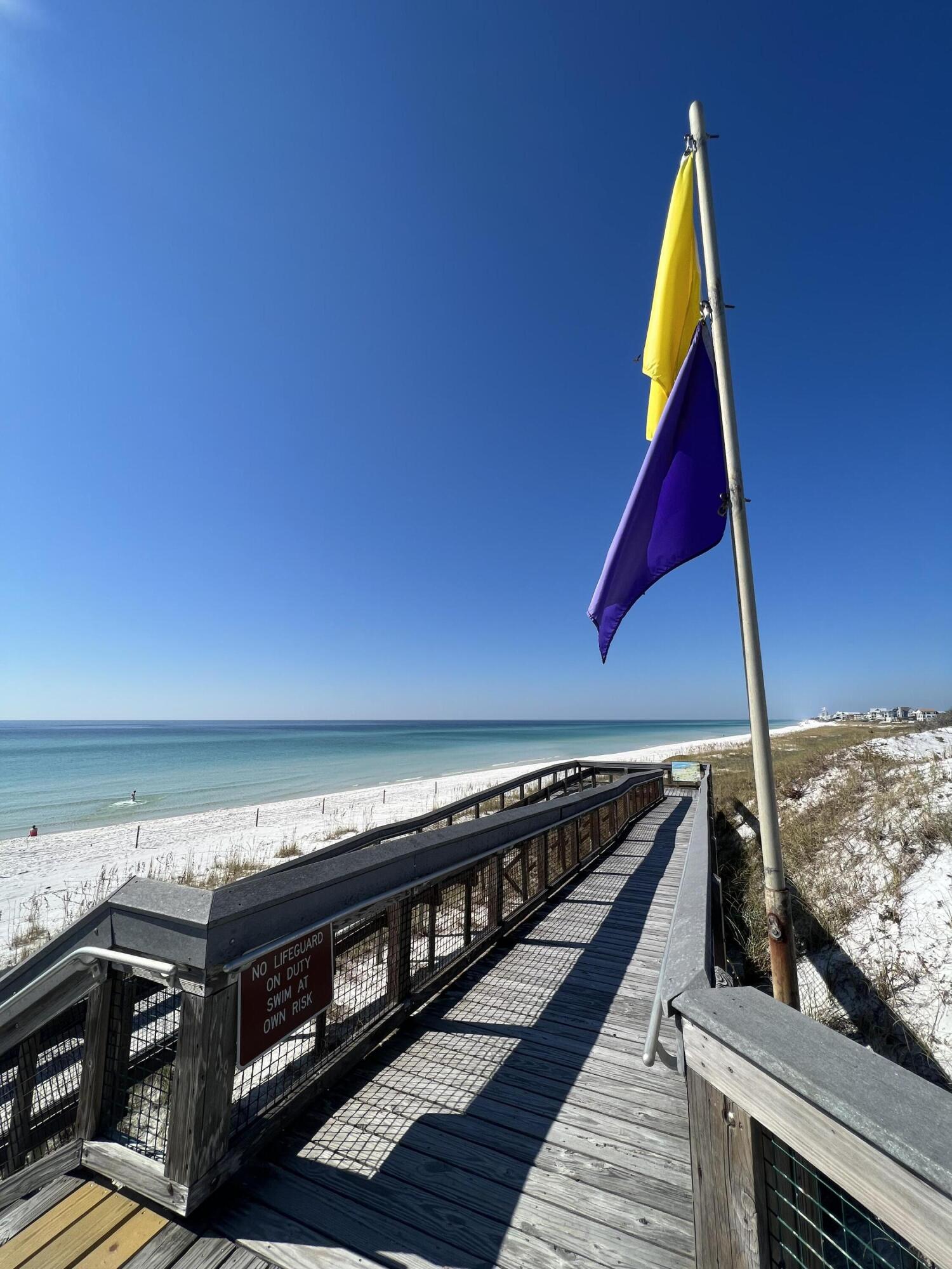 296 Milestone Dr Inlet Beach, Unit A Inlet Beach, FL 32461 - Photo 32 of 41 a view of roof deck with wooden floor and seating space