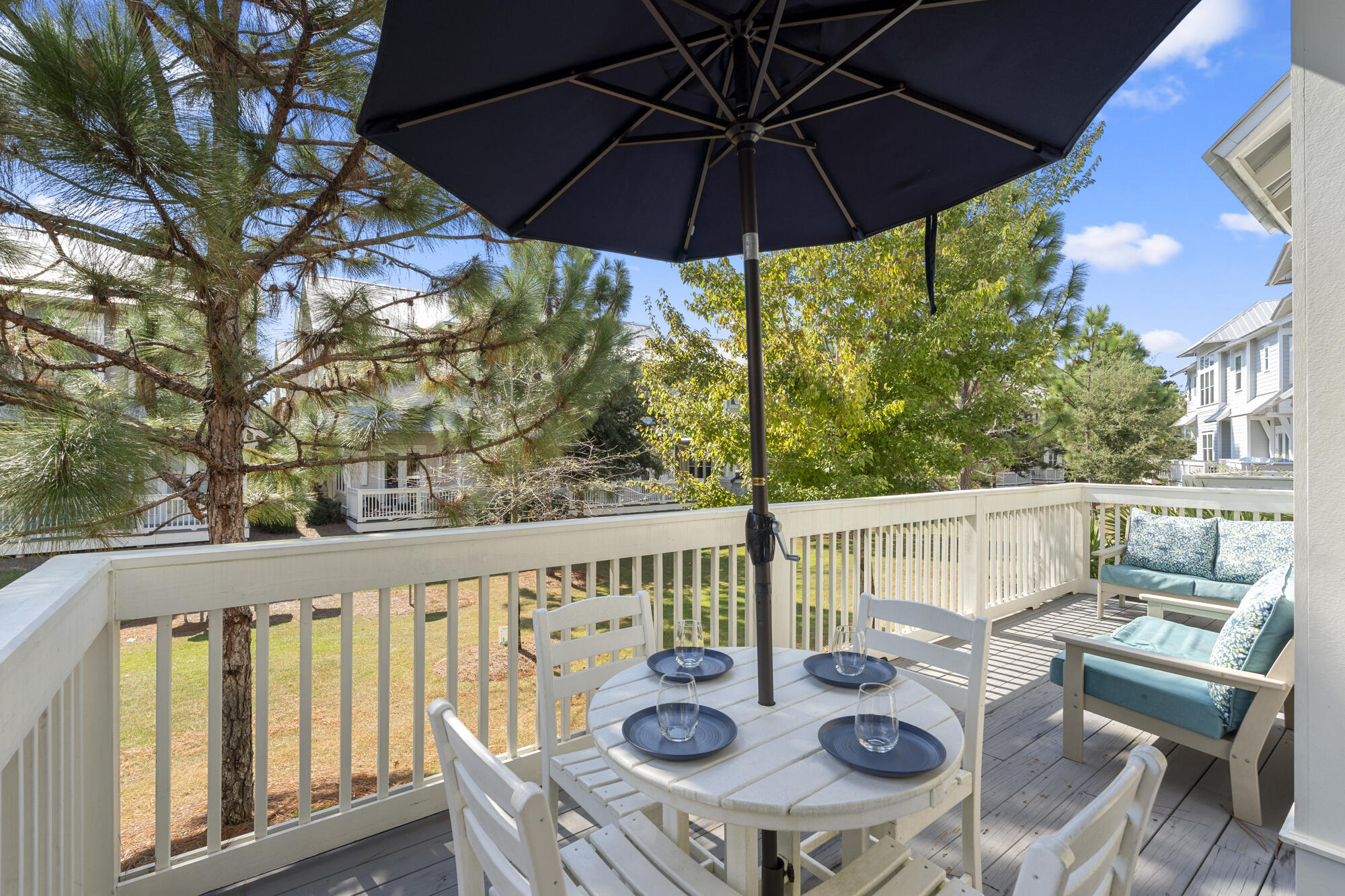296 Milestone Dr Inlet Beach, Unit A Inlet Beach, FL 32461 - Photo 5 of 41 a view of deck with furniture and umbrella