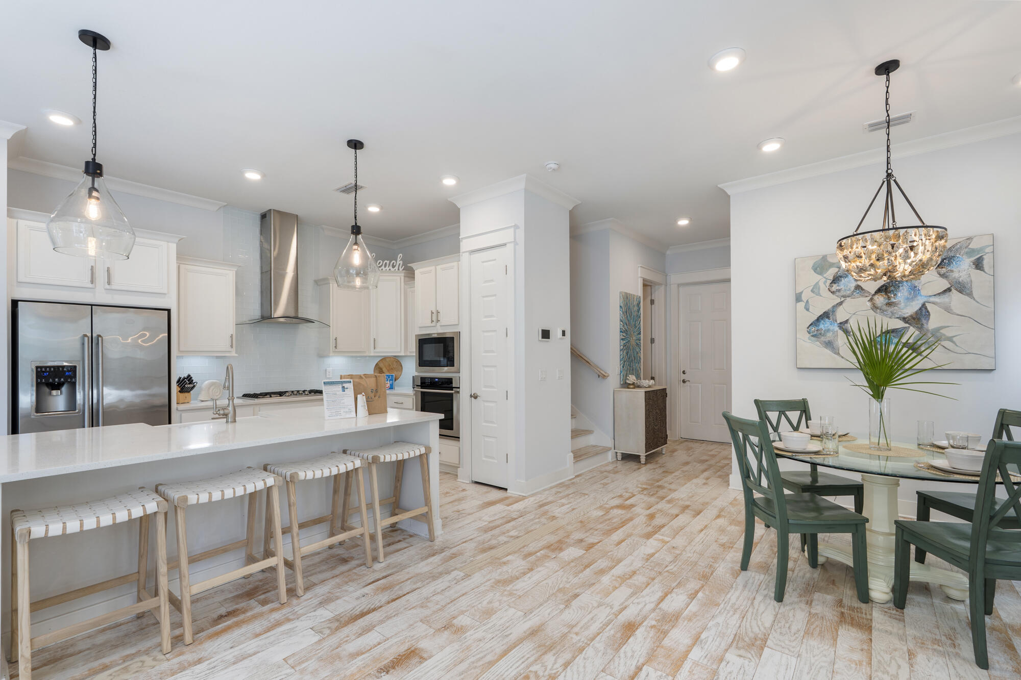 296 Milestone Dr Inlet Beach, Unit A Inlet Beach, FL 32461 - Photo 7 of 41 a large kitchen with a table and chairs in it