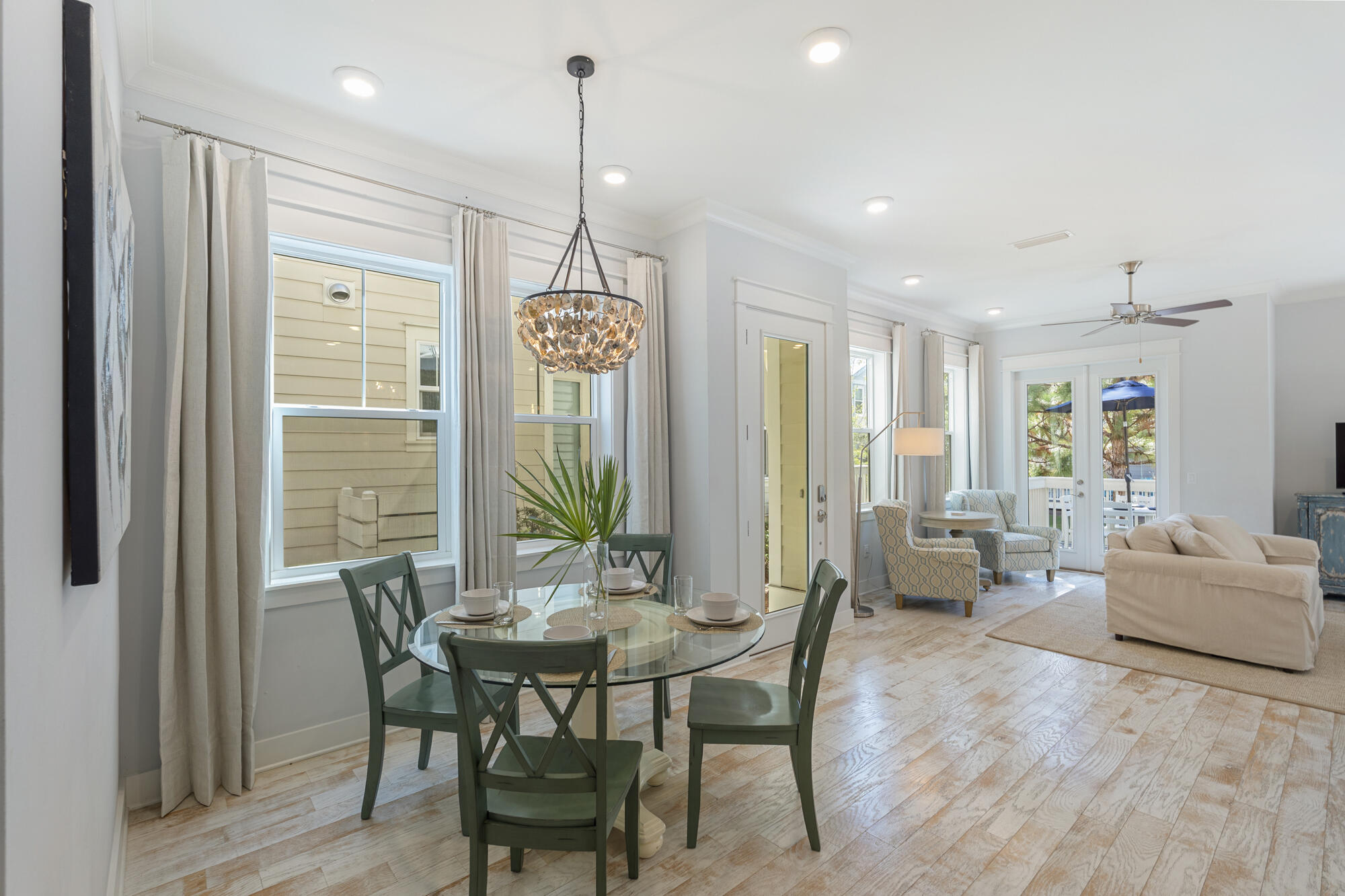 296 Milestone Dr Inlet Beach, Unit A Inlet Beach, FL 32461 - Photo 9 of 41 a view of a dining room with furniture window and wooden floor