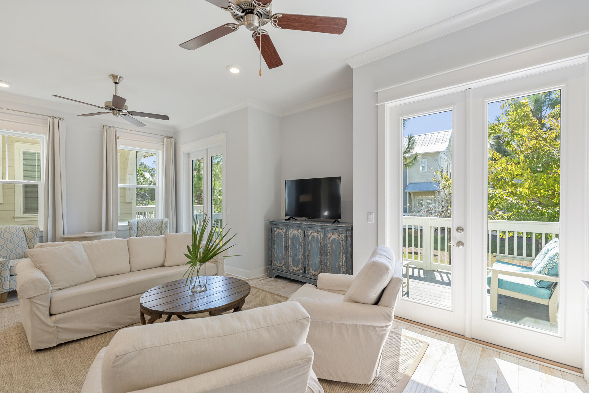 296 Milestone Dr Inlet Beach, Unit A Inlet Beach, FL 32461 - Photo 10 of 41 a living room with furniture and a flat screen tv