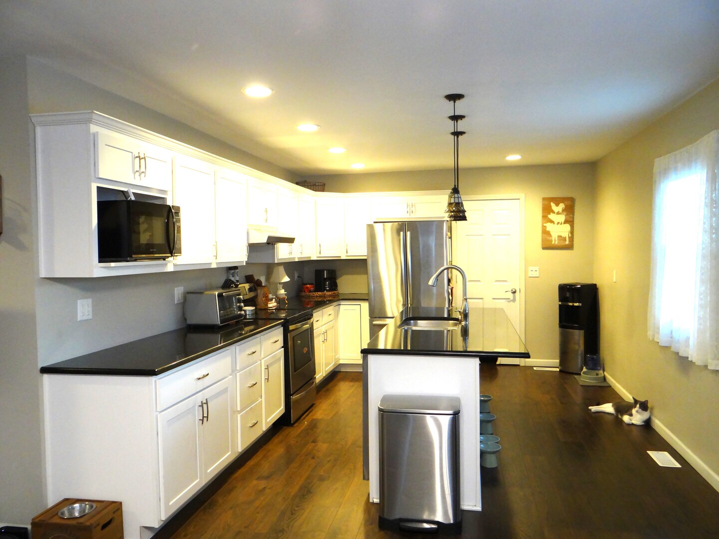 809 Douglas Street Morris, IL 60450 - Photo 6 of 22 a kitchen with stainless steel appliances granite countertop a sink a stove top oven a counter space and cabinets