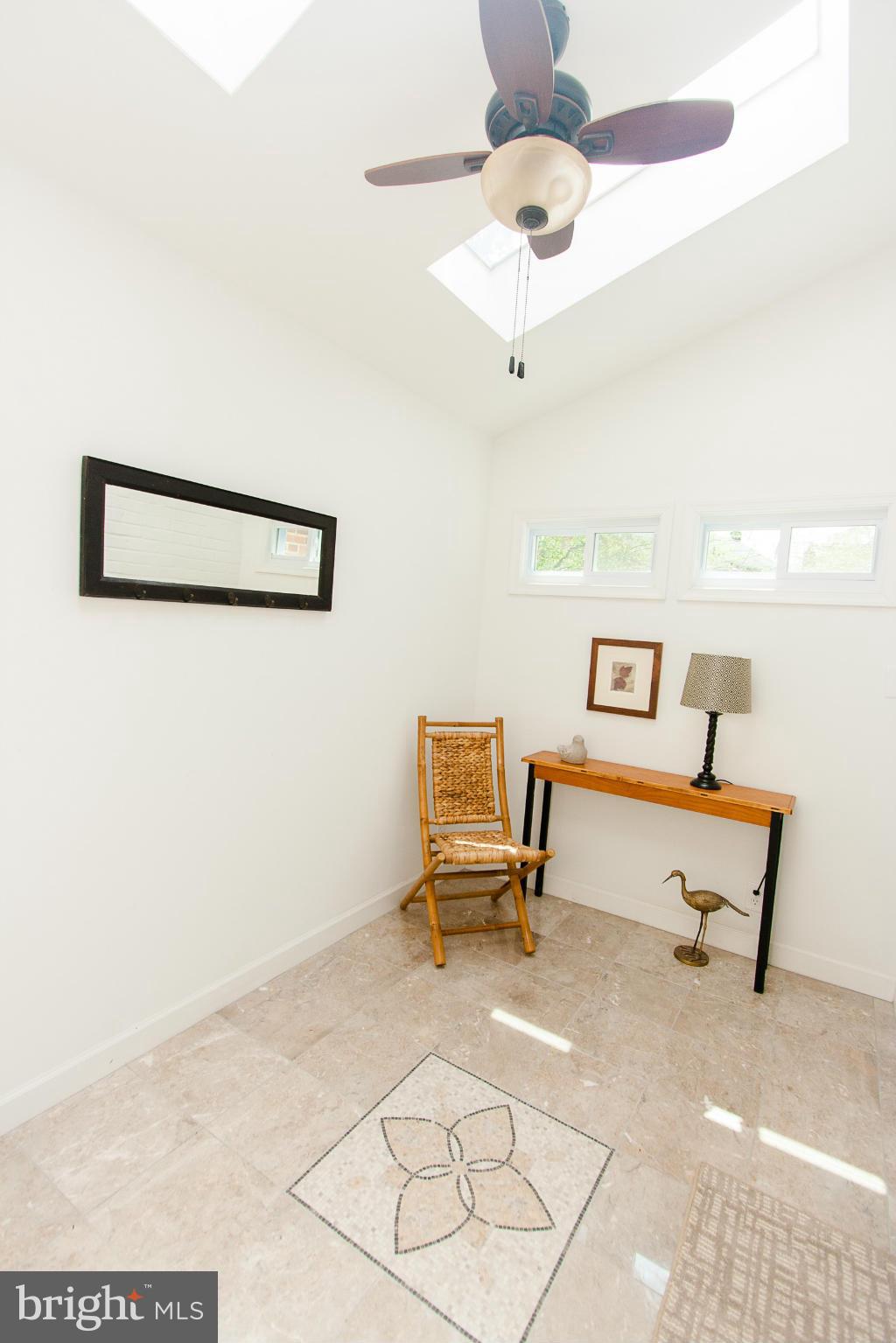 106 South Glebe Road Arlington, VA 22204 - Photo 3 of 28 a living room with furniture and a chandelier
