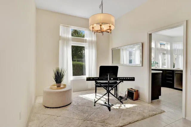 a view of a livingroom with furniture and a window